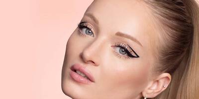 Creative Graphic Eyeliner Look with Long Lashes